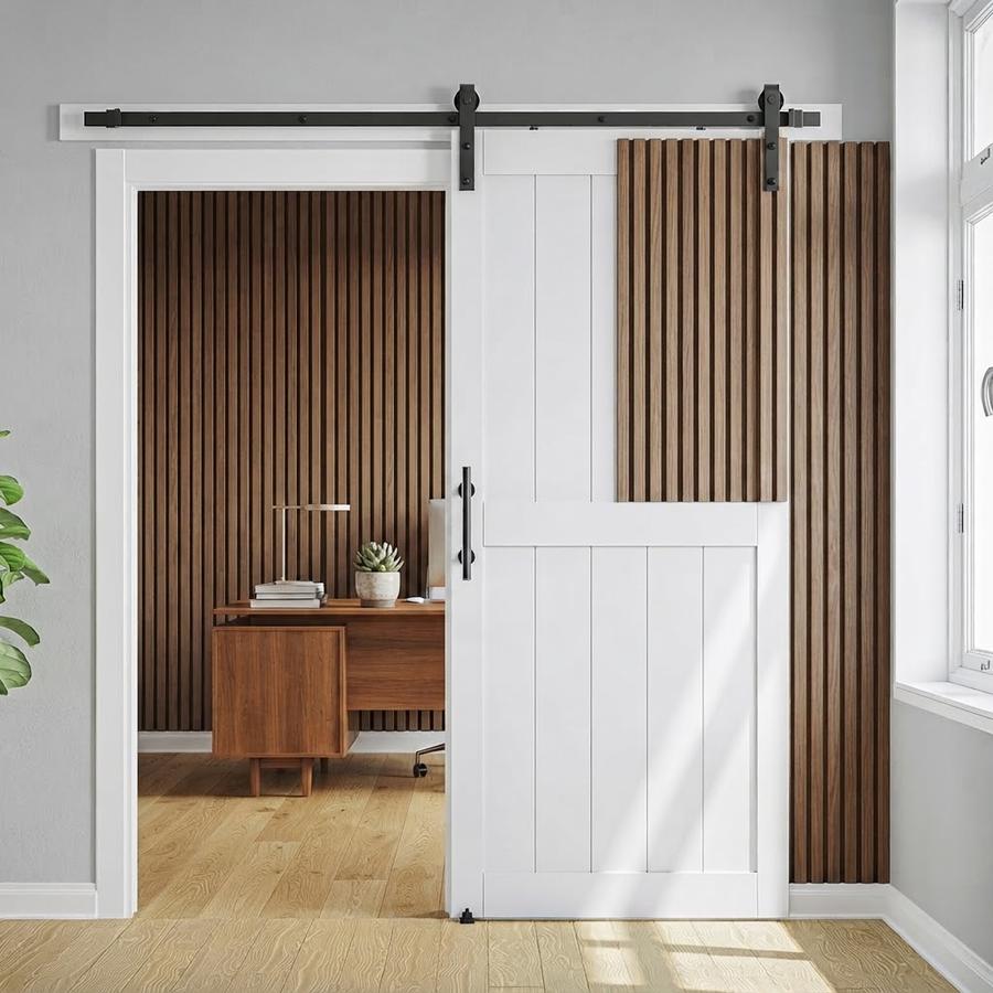 White paneled barn door rolled open across a laundry opening