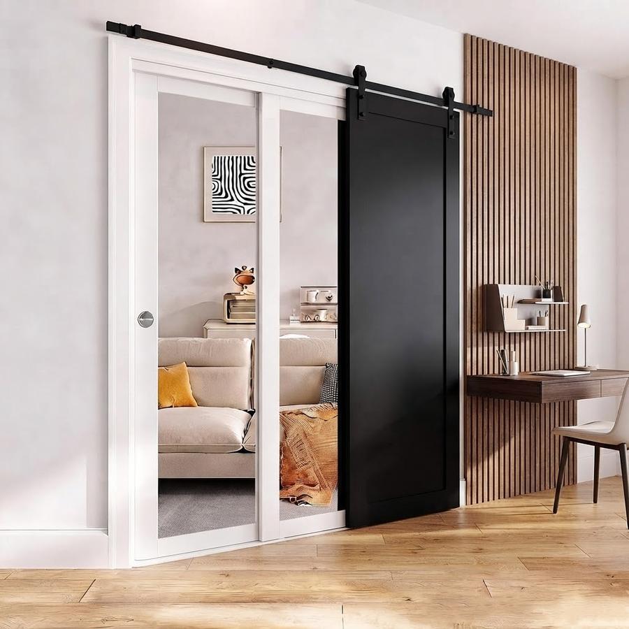 Mirrored sliding closet doors along a bedroom dressing wall